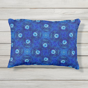 Cool, modern digital art of blue evil eye pattern outdoor pillow