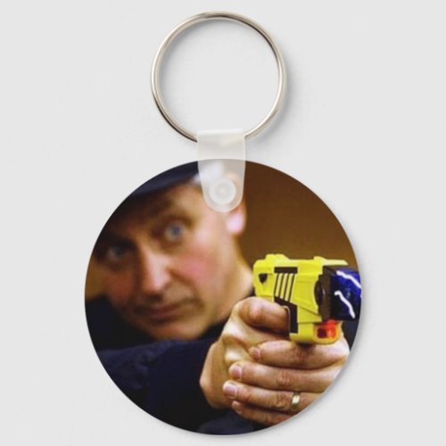 Cop With A Taser Gun Keychain