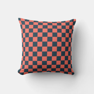 Coral and navy checkerboard pattern throw pillow