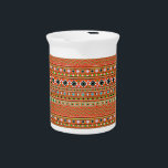 Coral Aztec Style Southwestern Pattern Drink Pitcher<br><div class="desc">This is an Aztec inspired tribal stripes pattern in shades of coral red. The main colors are coral,  blue,  green and purple in this intricate design with a hand painted effect. Diamond shapes,  stripes,  triangles and zig-zags make up the striped layers.</div>