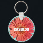 Coral Colored Gerbera Daisy Photo Mint Green Keychain<br><div class="desc">Add a burst of color to your day with this round keychain. It features a photo of a gerbera daisy in a bright coral color set against a mint green background. It's ready to be personalized with a name in bold white lettering. Makes a cute small gift or party favor....</div>