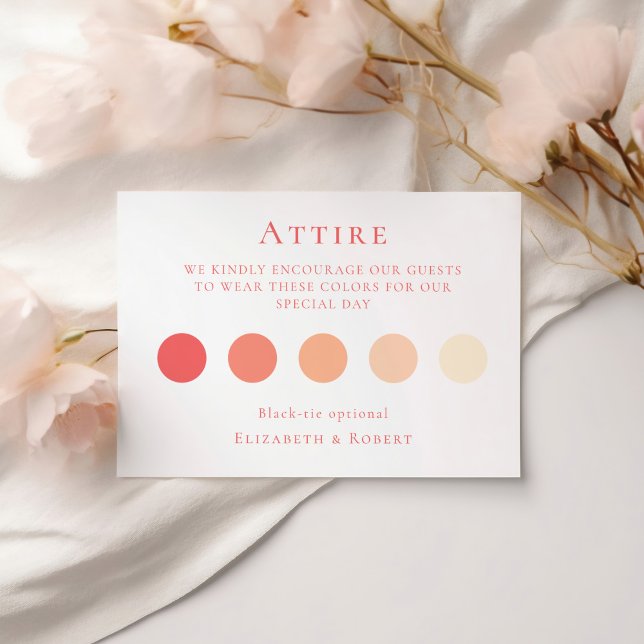 Coral Pink Wedding Attire Guest Dress Code Card (Coral Pink Wedding Attire Guest Dress Code Card on a white table with soft pink flowers.)