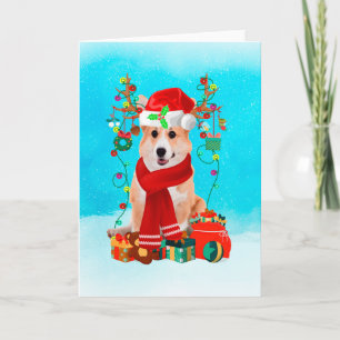 Corgi in snow with Christmas gifts Card