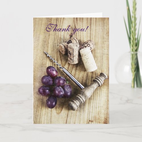 Corks grapes and corkscrew on wood thank you card