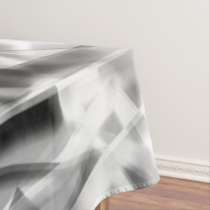 Corner of square pieces of acrylic, grey to white tablecloth