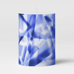 Corner of square pieces of acrylic, white to blue pillar candle