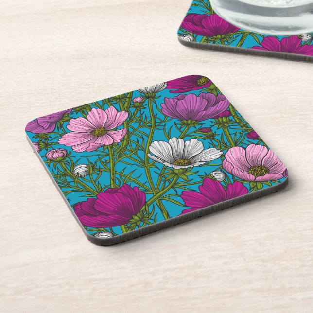 Cosmos mix on blue beverage coaster (Left Side)