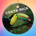 Costa Rica Toucan Ceramic Ornament<br><div class="desc">Costa Rica Toucan photo commemorative ornament to celebrate happy memories of your tropical vacation. Photo of a colorful Toucan in a tree,  along with Costa Rica in fun typography. Choose your ornament shape.</div>