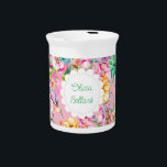 Cottagecore Hummingbird  Beverage Pitcher<br><div class="desc">A Cottagecore Hummingbird floral for your spring or summer bridal shower. Pastel profusion of hues and an abundance of flowers frames a cute cottage doily label. Pretty fonts watercolor floral, pink and white, with a darling hummingbird. Pinks, white, peach, bluish green succulent foliage, and a touch of violet. Customize the...</div>