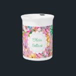 Cottagecore Hummingbird  Beverage Pitcher<br><div class="desc">A Cottagecore Hummingbird floral for your spring or summer bridal shower. Pastel profusion of hues and an abundance of flowers frames a cute cottage doily label. Pretty fonts watercolor floral, pink and white, with a darling hummingbird. Pinks, white, peach, bluish green succulent foliage, and a touch of violet. Customize the...</div>