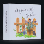 Country Gardening Scene - A Year in the Garden 3 Ring Binder<br><div class="desc">Personalized design - perfect as a gardening planner. The cover is light blue with elegant hand lettered script typography which reads "A Year in the Garden" with watercolor illustration of a country cottage garden. It features a picket fence and plant pot of pansy flowers, a grass lawn, blackbird, butterfly and...</div>