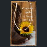 Country Sunflower Congratulations Western Wedding Small Gift Bag<br><div class="desc">Fill the charming Country Sunflower Congratulations Western Wedding Gift Bag with your present for the newlywed bride and groom. These casual yet classy custom rustic chic ranch style wedding congrats bags feature a quaint floral photograph of a yellow sunflower blossom and brown leather cowboy boots with a brown barn wood...</div>