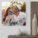 Couple Photo Love and Hearts Calligraphy Square Wall Clock<br><div class="desc">Create your own unique photo clock. The photo template is set up ready for you to add your own picture which will automatically fill the entire clock face. The hand lettered text overlay simply reads "love" in beautiful calligraphy with love hearts at each end. You can customize this versatile, frameless...</div>