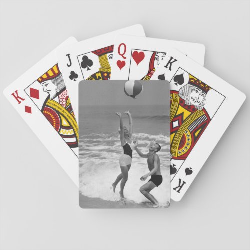 Couple Playing with a Beachball Poker Cards