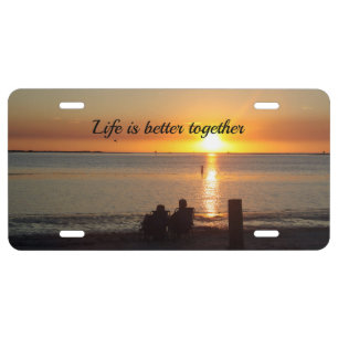 Couple Sit On Beach At Sunset License Plate