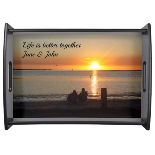 Couple Sit On Beach At Sunset Serving Tray
