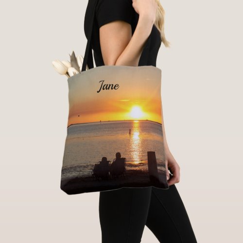 Couple Sit On Beach At Sunset Tote Bag