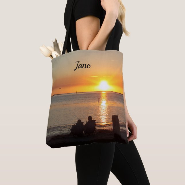 Couple Sit On Beach At Sunset Tote Bag (Close Up)