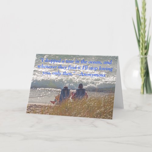 COUPLE SITTING CONTENTEDLY ON BEACH ANNIVERSARY CARD