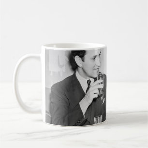 Couple sitting together in a restaurant flirting w coffee mug