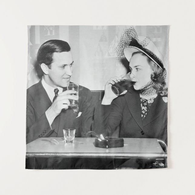 Couple sitting together in a restaurant flirting w tapestry (Front)