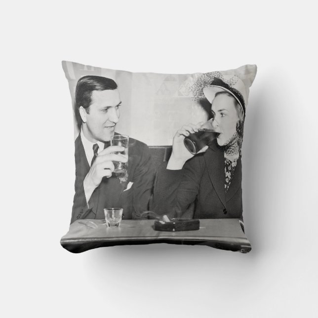 Couple sitting together in a restaurant flirting w throw pillow (Front)