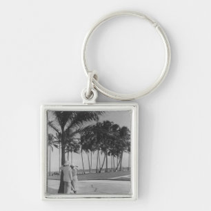 Couple standing at palm tree Rear view B&W Keychain