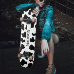 Cow Animal Print Spotted Black & White Name Skateboard<br><div class="desc">Black and white cow hide animal print skateboard with name text.  Unisex design for men and for women. Suitable for kids and adults.  Great for cowboy / cowgirl country farm themes.</div>