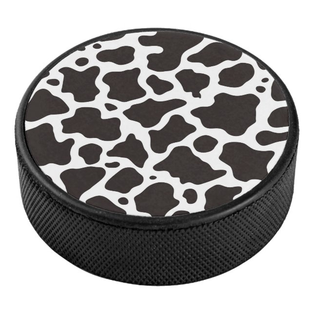 Cow pattern background hockey puck (3/4)