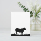 Cow standing resolutely on a dike, with copy space (Standing Front)