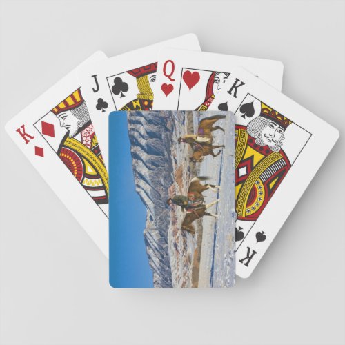 Cowboy and Cowgirl riding Horse through the Snow Poker Cards