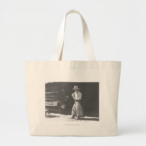Cowboy eating from a Peter Pan peanutbutter can Large Tote Bag