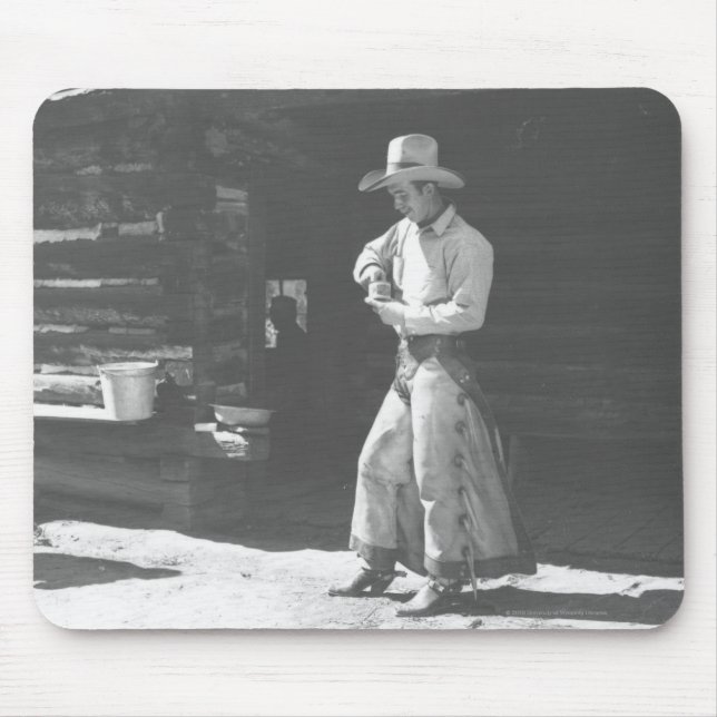 Cowboy eating from a Peter Pan peanutbutter can. Mouse Pad (Front)