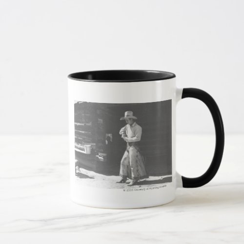 Cowboy eating from a Peter Pan peanutbutter can Mug