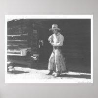 Cowboy eating from a Peter Pan peanutbutter can.