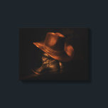 Cowboy Hat and Leather Boots Rustic Masculine Canvas Print<br><div class="desc">A pair of black leather cowboy boots stand on the floor with a brown cowboy hat draped over the top.</div>