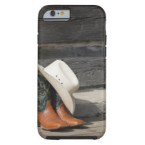 Cowboy hat on cowboy boots outside a log cabin tough iPhone 6 case