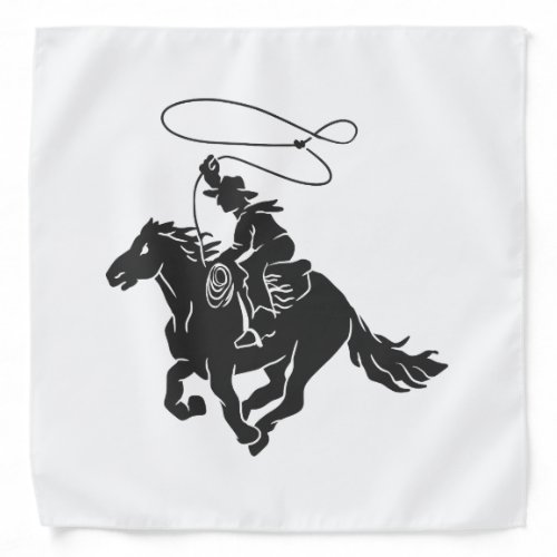 Cowboy on bucking horse running with lasso bandana