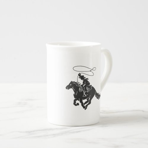 Cowboy on bucking horse running with lasso bone china mug