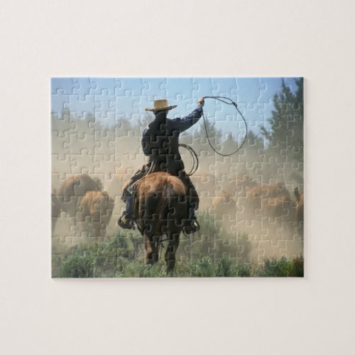 Cowboy on horse with lasso driving cattle jigsaw puzzle