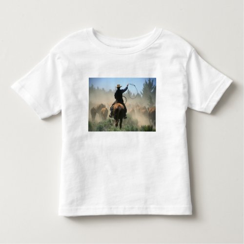Cowboy on horse with lasso driving cattle toddler t_shirt