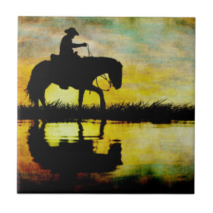 Cowboy on Horseback at Sunset. Ceramic Tile