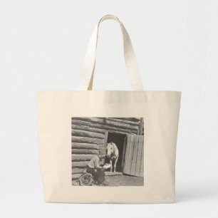 Cowboy reading a letter with a horse large tote bag