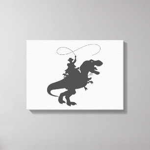 Cowboy riding dinosaur in the prehistoric era canvas print