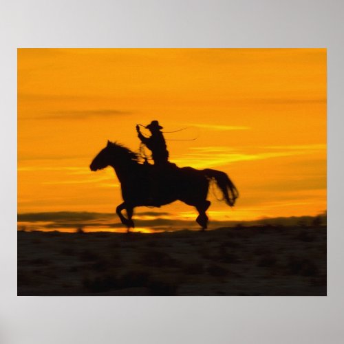 Cowboy riding in the Sunset with lariat Rope Poster
