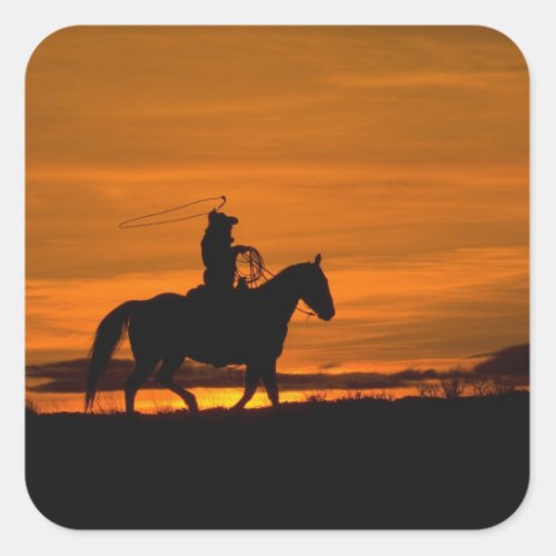 Cowboy riding in the Sunset with lariat Rope Square Sticker