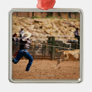 Cowboy roping calf in rodeo metal ornament