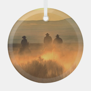 Cowboy Trio: Mountainous Background Gallop. Glass Ornament
