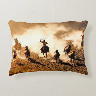 Cowboys chasing wilding horses. roping and riding, accent pillow