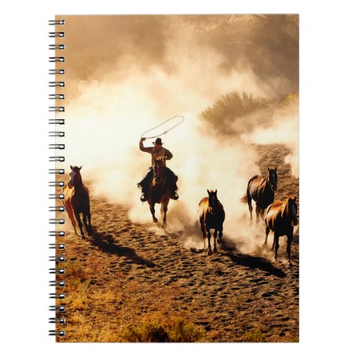 Cowboys chasing wilding horses roping and riding notebook